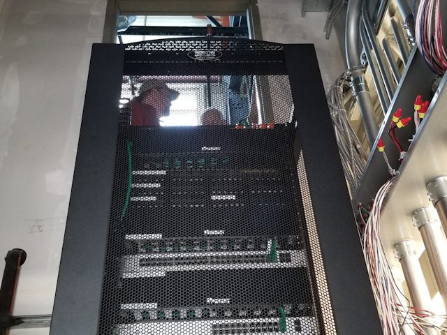 Network Switch With Two Guys At The Back